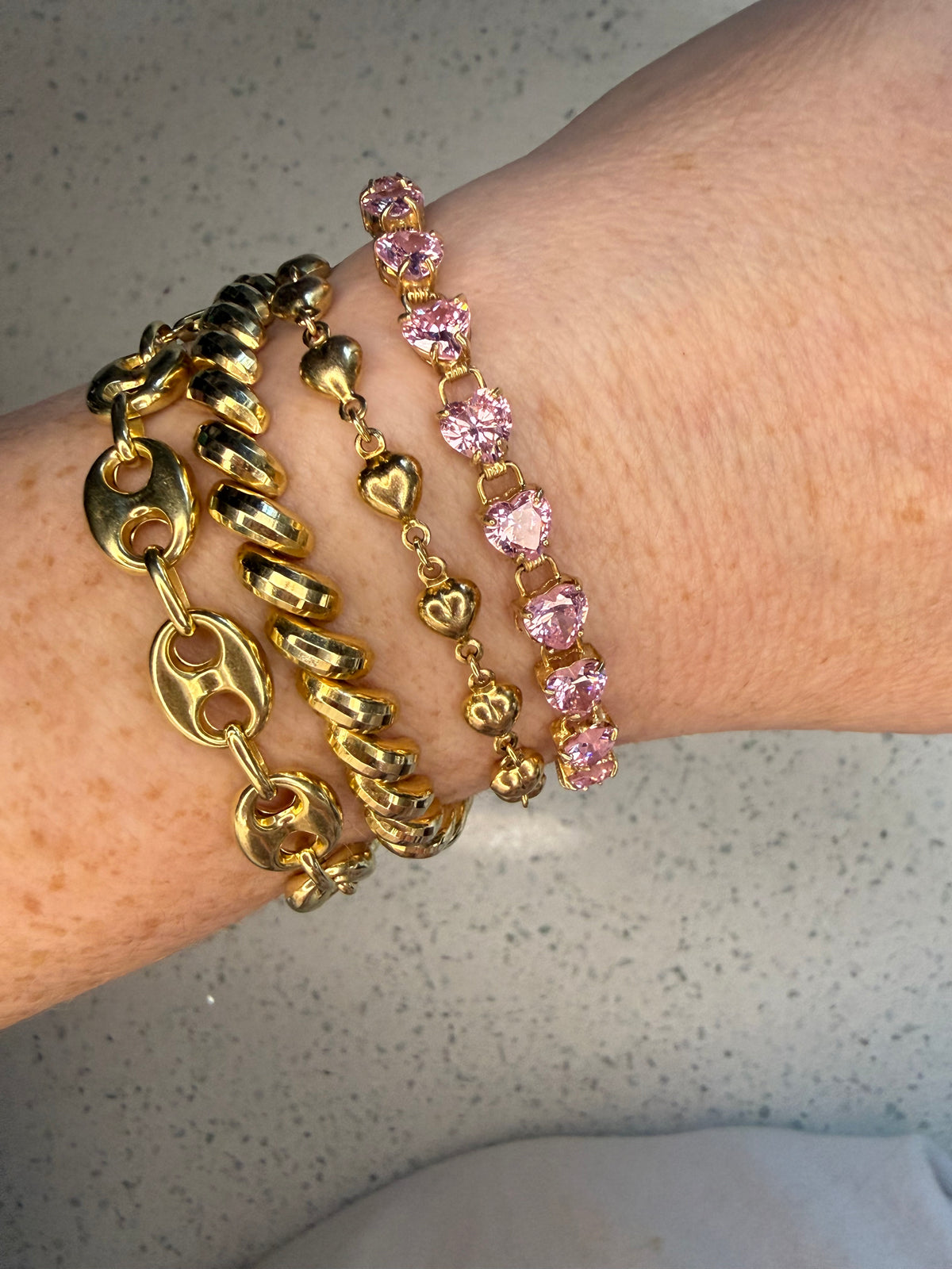 10k yellow gold pink heart CZ tennis bracelet 7”