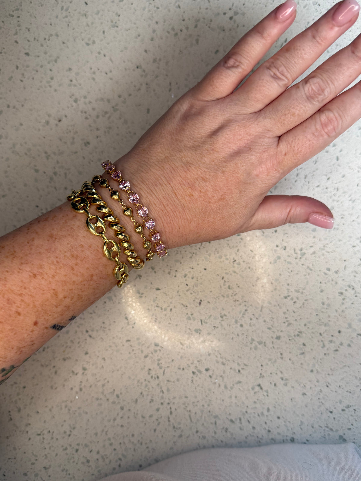 10k yellow gold pink heart CZ tennis bracelet 7”